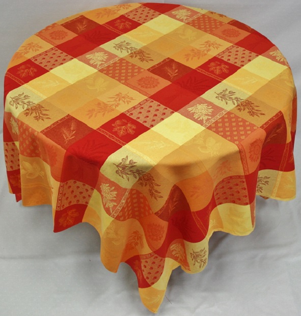 A table cloth would red, orange, and yellow table cloth