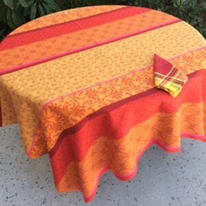 An orange and bright red pattern on a table cloth