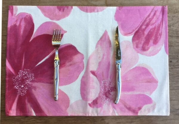 A placemat with huge pink flowers