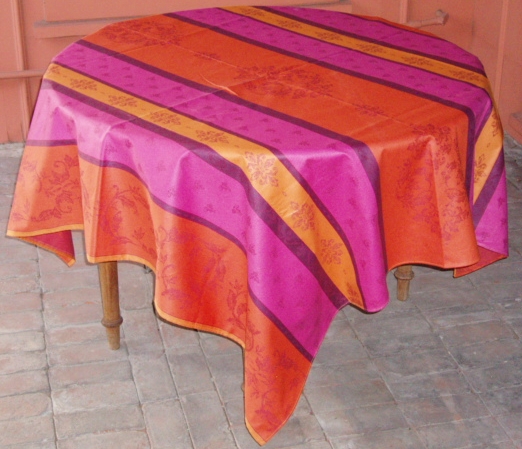 A pattern of orange, pink, and purple table cloth
