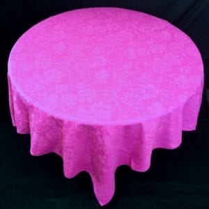 A dark pink table cloth with patterns