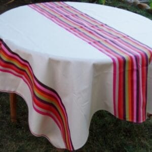 A white table cloth with butterfly designs at the center