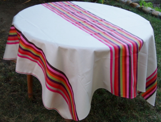 A white table cloth with butterfly designs at the center