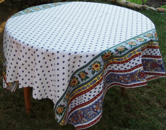 A white table cloth with pink designs