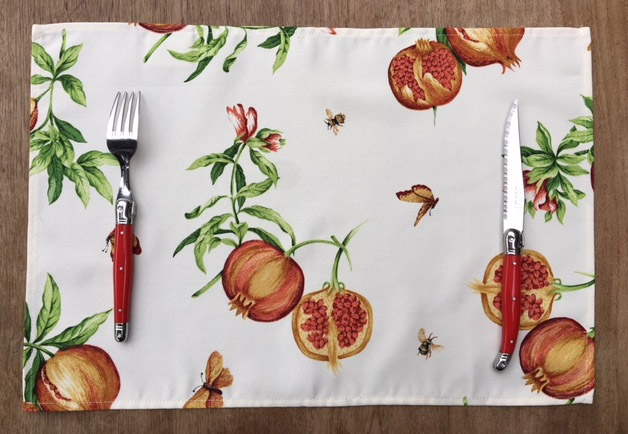 A placemat with pomegranate designs