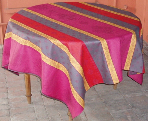 A blue, pink, and red table cloth pattern