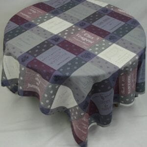 A dark colored table cloth with square patterns