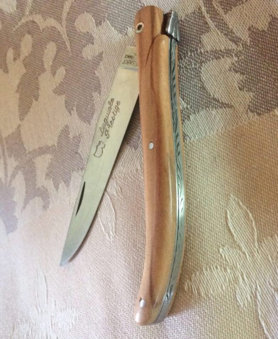 A pocket knife with a wooden handle