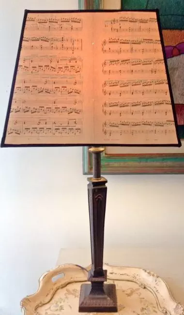 A lamp with a musical score as the shade
